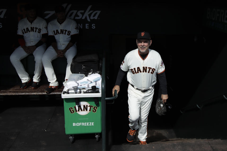 San Francisco Giants manager Bruce Bochy walks into the dugout before a baseball game between the Giants and the Los Angeles Dodgers in San Francisco, Sunday, Sept. 29, 2019. (AP Photo/Jeff Chiu)