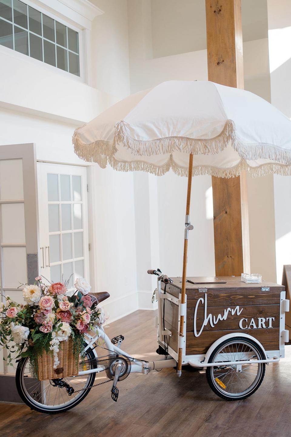 A "churn cart" ice cream cart with flowers on it.