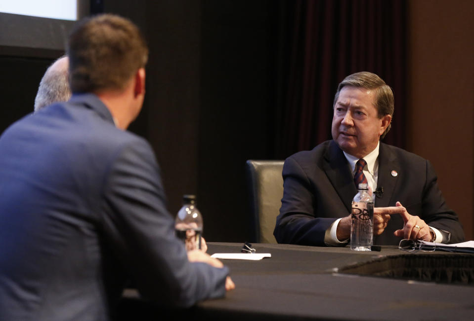 Oklahoma Democratic gubernatorial candidate Drew Edmondson, right, answers a question during a gubernatorial forum in Oklahoma City, Monday, Sept. 24, 2018. Republican candidate Kevin Stitt is at left. (AP Photo/Sue Ogrocki)