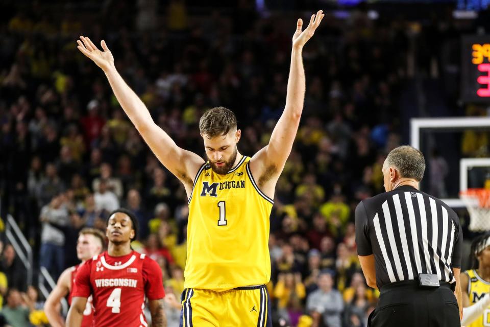 Then with Michigan, Hunter Dickinson celebrates during a game against Wisconsin on Feb. 26, 2023.