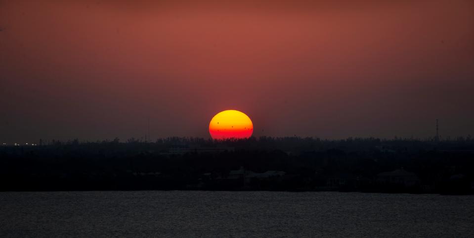 The sun sets over the Caloosahatchee River on Thursday, March 9, 2023. Photographed from the Beacon Social Drinkery in the Luminary Hotel. It is a great spot to view a sunset.  