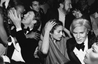 <p>Halston, Andy Warhol, Bianca Jagger, and Liza Minnelli were part of the usual crowd at Studio 54 during its prime. Here, the group dances the the club at a New Year's Eve bash.</p>
