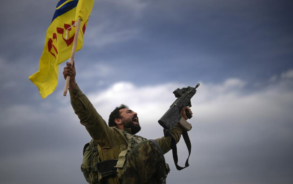 An Israeli soldier celebrates after returning from the Gaza Strip