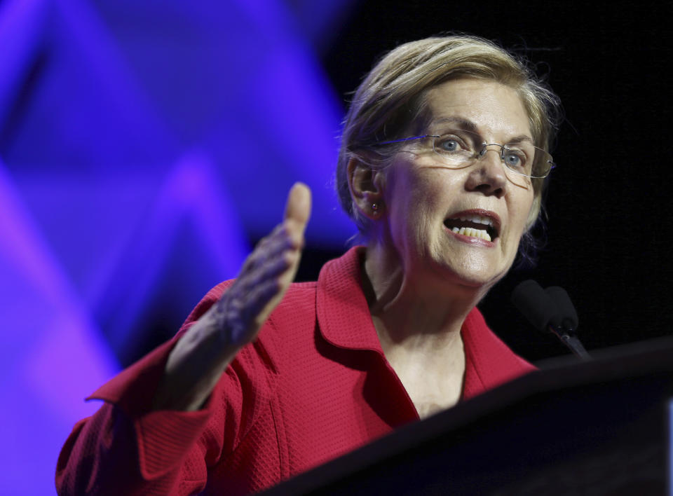 FILE - In this June 1, 2018 file photo, Sen. Elizabeth Warren, D-Mass., speaks at the 2018 Massachusetts Democratic Party Convention in Worcester, Mass. Warren has released results of a DNA test showing Native American ancestry in an effort to diffuse the issue ahead of any presidential run. (AP Photo/Elise Amendola)