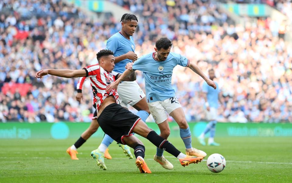 : Daniel Jebbison of Sheffield United fouls Bernardo Silva of Manchester City which leads to a Manchester City penalty during the FA Cup Semi Final match between Manchester City and Sheffield United - Justin Setterfield/The FA via Getty Images