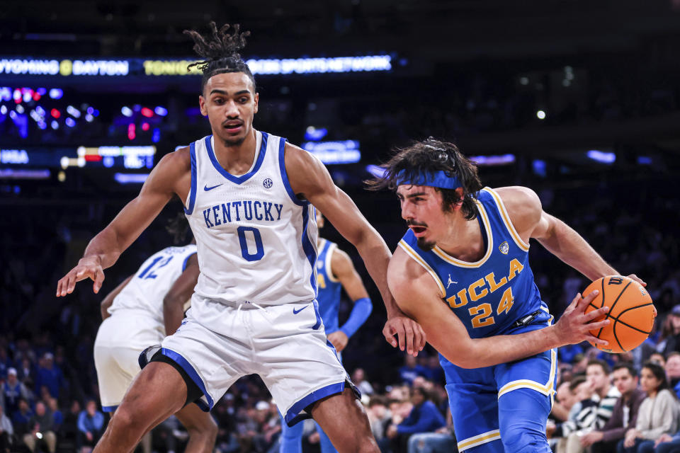 Kentucky forward Jacob Toppin (0) guards UCLA guard Jaime Jaquez Jr. (24) during an NCAA college basketball game in the CBS Sports Classic, Saturday, Dec. 17, 2022, in New York. The Bruins won 63-53. (AP Photo/Julia Nikhinson)