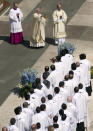 Pope Francis spreads incense as he celebrates an Easter Mass in St. Peter's Square at the the Vatican, Sunday, April 20, 2014. Francis is celebrating Christianity's most joyous day, Easter Sunday, under sunny skies in St. Peter's. (AP Photo/Andrew Medichini)