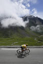 Slovenia's Tadej Pogacar, wearing the overall leader's yellow jersey, speeds down Tourmalet pass during the eighteenth stage of the Tour de France cycling race over 129.7 kilometers (80.6 miles) with start in Pau and finish in Luz Ardiden, France,Thursday, July 15, 2021. (AP Photo/Christophe Ena)