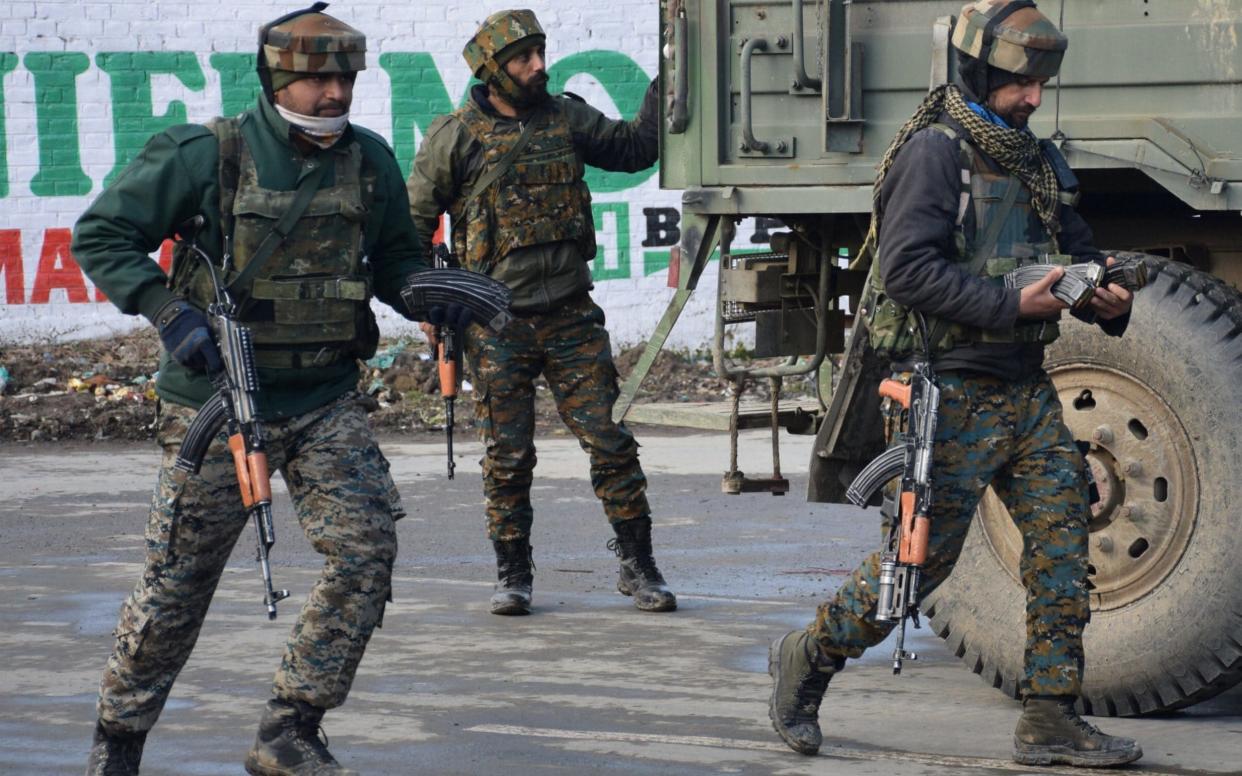 Indian Army soldiers arrive near the site of a gun battle between suspected militants and Indian security forces in Pinglan village in south Kashmir's Pulwama - REUTERS