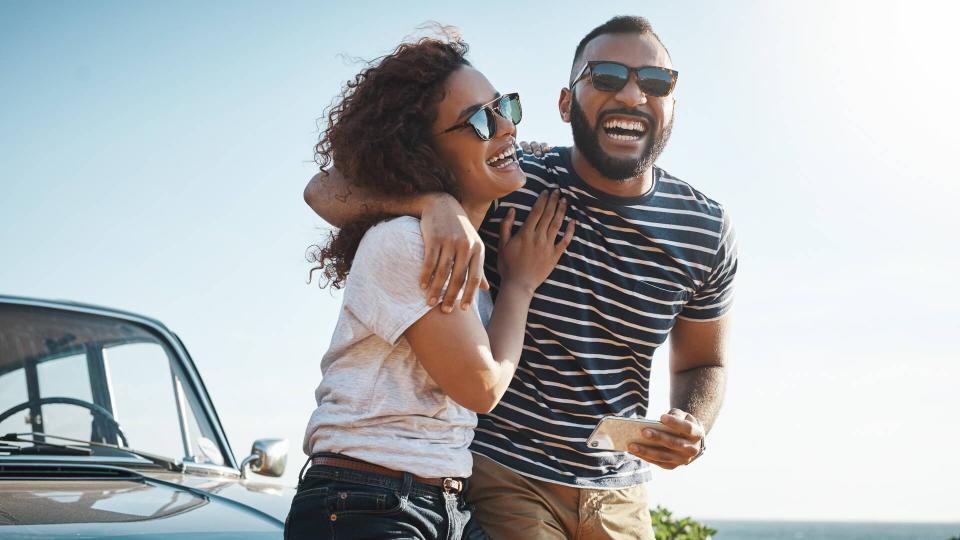 Shot of a young couple enjoying a summerâ€™s road trip together.