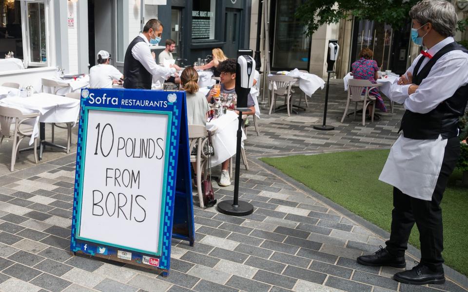 A London restaurant advertises its participation in the Eat Out To Help Out scheme   - Leon Neal/Getty Images