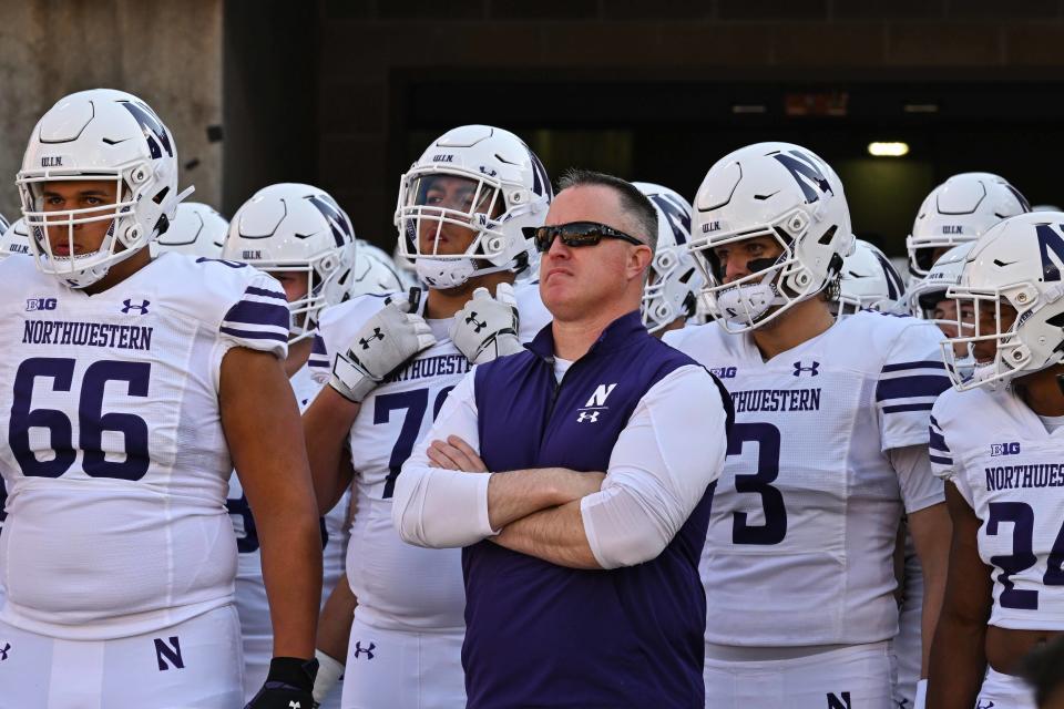 Oct 29, 2022; Iowa City, Iowa, USA; Northwestern head coach Pat Fitzgerald and the Wildcats team before the game against the Iowa Hawkeyes at Kinnick Stadium. Mandatory Credit: Jeffrey Becker-USA TODAY Sports