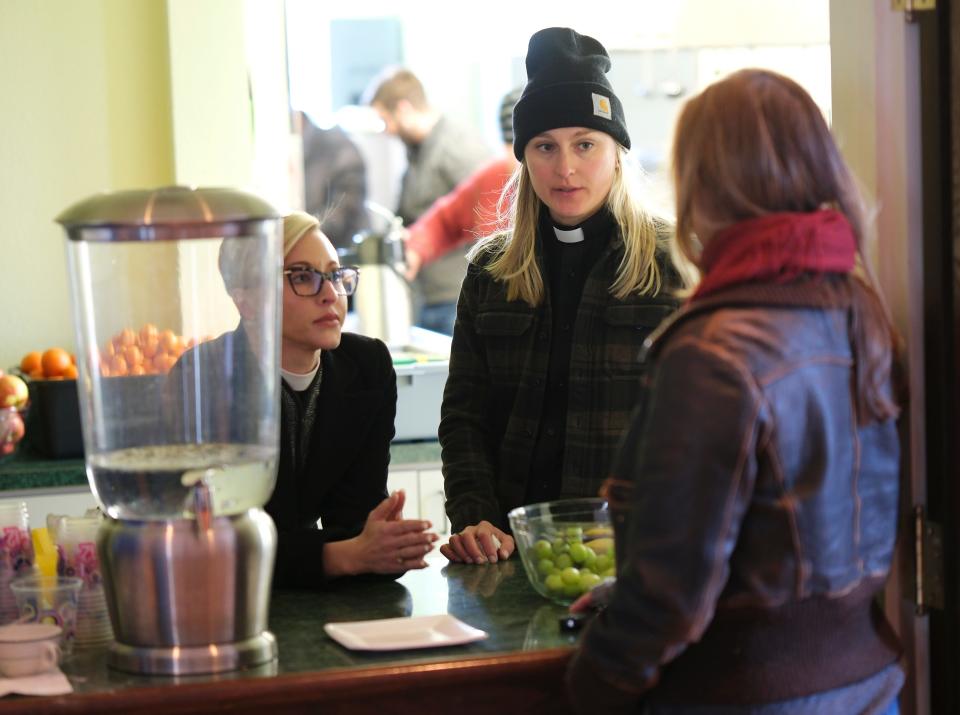The Rev. Katie Churchwell, dean of St. Paul's, left, and the Rev. Sarah Smith, an associate priest at St. Paul's Episcopal Cathedral, talk Monday, Jan. 30, 2023, with a volunteer. St. Paul's has opened its doors to the homeless for this stretch of extremely cold weather.