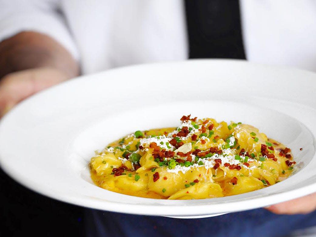 The sweet corn agnolotti at Buccan combines the corn with ricotta, bacon, peas and espellette butter.