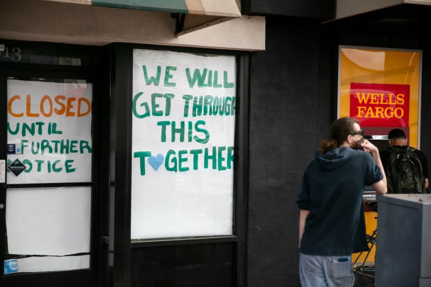 A boutique is shut down on University Avenue, immediately next to a Wells Fargo ATM on May 28, 2020 in San Diego, California.