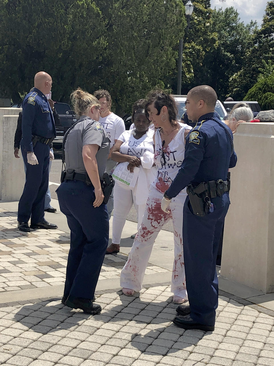 Abortion rights supporters protest outside the Louisiana House chamber, objecting to the advancement of a bill that would ban abortion when a fetal heartbeat is detected, on Wednesday, May 15, 2019, in Baton Rouge, La. (AP Photo/Melinda Deslatte) (AP Photo/Melinda Deslatte)