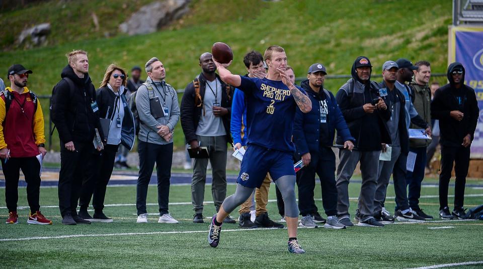 Shepherd University quarterback Tyson Bagent throws a pass in front of NFL scouts and personnel at Pro Day on Tuesday at Ram Stadium.