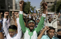 Supporters of the Muslims Students Organization chant slogans during a protest against French President and against the publishing of caricatures of the Prophet Muhammad they deem blasphemous, in Karachi, Pakistan, Friday, Oct. 30, 2020. Muslims have been calling for both protests and a boycott of French goods in response to France's stance on caricatures of Islam's most revered prophet. (AP Photo/Fareed Khan)