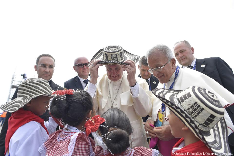 Pope Francis is welcomed at the airport of Cartagena, Colombia, Sunday, Sept. 10, 2017. Pope Francis arrived to Cartagena to honor St. Peter Claver, a 17th-century Jesuit who ministered to the tens of thousands of African slaves who arrived in the port to be sold. Francis returns to Rome on Sunday night. (L’Osservatore Romano/Pool Photo via AP)