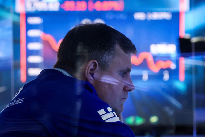 Traders work on the floor of the NYSE in New York