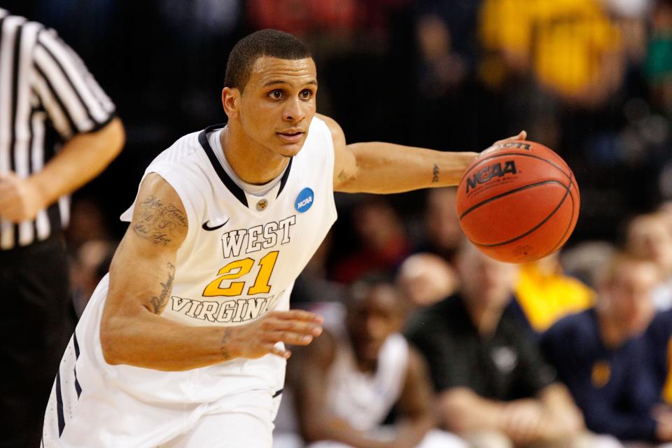 Joe Mazzulla #21 of the West Virginia Mountaineers drives against the Clemson Tigers during the second round of the 2011 NCAA men's basketball tournament at St. Pete Times Forum on March 17, 2011 in Tampa, Florida.