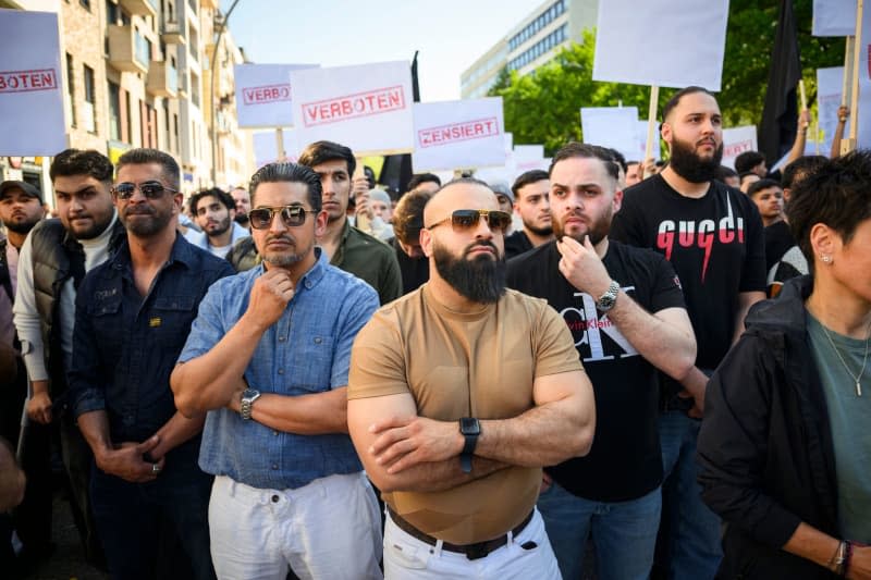 Demonstrators hold up signs with the words "Forbidden" and "Censored" at a rally organized by the Islamist network Muslim Interactive entitled "Against censorship and the dictation of opinion" in Hamburg's St. Georg district. Gregor Fischer/dpa