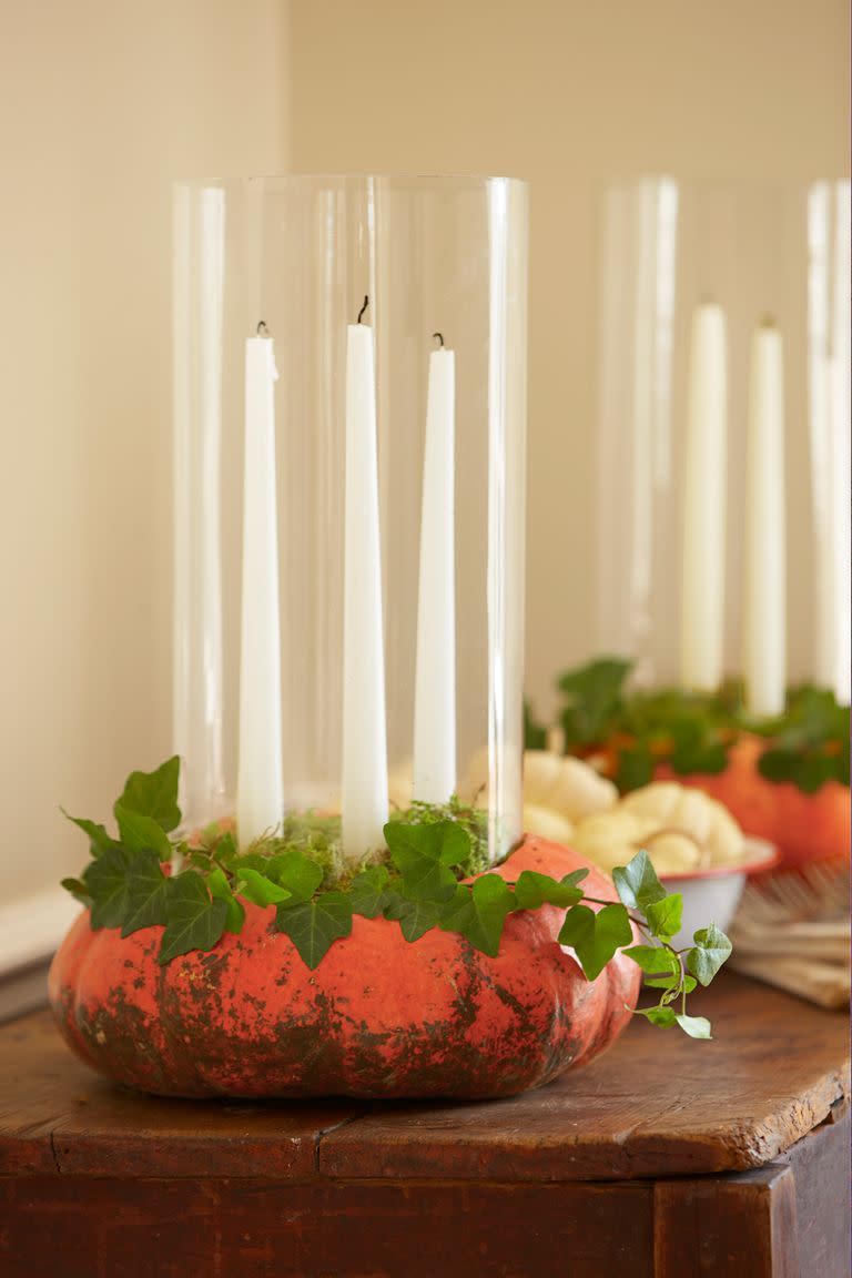 <p>Bring pumpkins to life with a collection of white taper candles and trailing ivy.</p><p><a class="link " href="https://go.redirectingat.com?id=74968X1596630&url=https%3A%2F%2Fwww.potterybarn.com%2Fproducts%2Fpb-boxed-taper-candles%2F&sref=https%3A%2F%2Fwww.goodhousekeeping.com%2Fholidays%2Fhalloween-ideas%2Fg33437890%2Fhalloween-table-decorations-centerpieces%2F" rel="nofollow noopener" target="_blank" data-ylk="slk:SHOP TAPER CANDLES;elm:context_link;itc:0;sec:content-canvas">SHOP TAPER CANDLES</a></p>