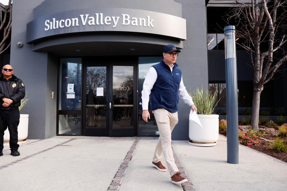 A customer leaves after speaking with FDIC representatives inside of the Silicon Valley Bank headquarters in Santa Clara, California, U.S., March 13, 2023. REUTERS/Brittany Hosea-Small