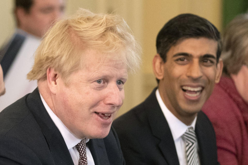 Prime Minister Boris Johnson, alongside new Chancellor of the Exchequer Rishi Sunak (right)