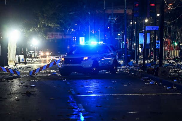 PHOTO: Police officers work on the scene of a shooting that occured during the Krewe of Bacchus parade in New Orleans, Feb. 19, 2023. (Chandan Khanna/AFP via Getty Images)