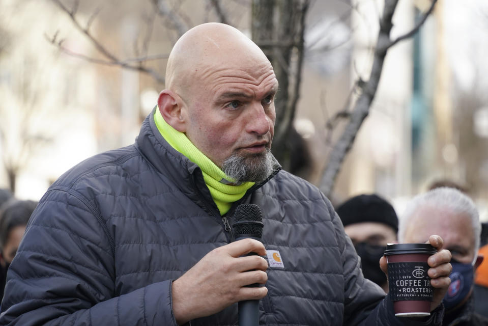 FILE - Pennsylvania Lt. Gov. and U.S. Senate candidate, John Fetterman, speaks at a rally supporting unionization efforts at a coffee shop in Pittsburgh's Squirrel Hill neighborhood Jan. 5, 2022. President Joe Biden will appear in Pittsburgh on Friday as the opening step in a broader campaign to promote the White House's achievements in key states ahead of the midterm elections. Fetterman, a leading Senate candidate, and state Attorney General Josh Shapiro, the likely Democratic nominee in the race for governor, will be absent because of scheduling conflicts, according to their respective spokespeople. (AP Photo/Keith Srakocic, File)