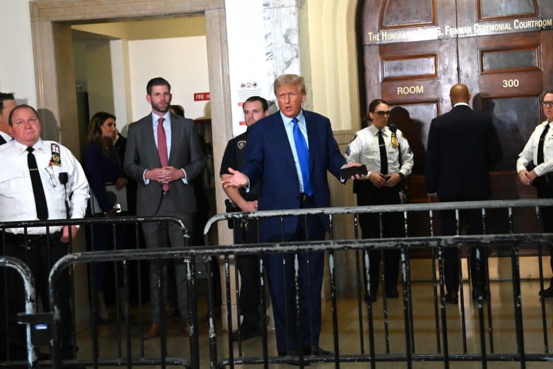 Former President Donald Trump speaks outside the courtroom in the fourth week of his civil fraud trial at State Supreme Court on Tuesday in New York City. The case brought last September by New York Attorney General Letitia James, accuses Trump, his eldest sons and his family business of inflating Trump's net worth by more than $2 billion by overvaluing his real estate portfolio. Photo by Louis Lanzano/UPI