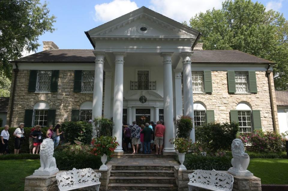 Visitors line up to enter the Graceland mansion. AFP via Getty Images