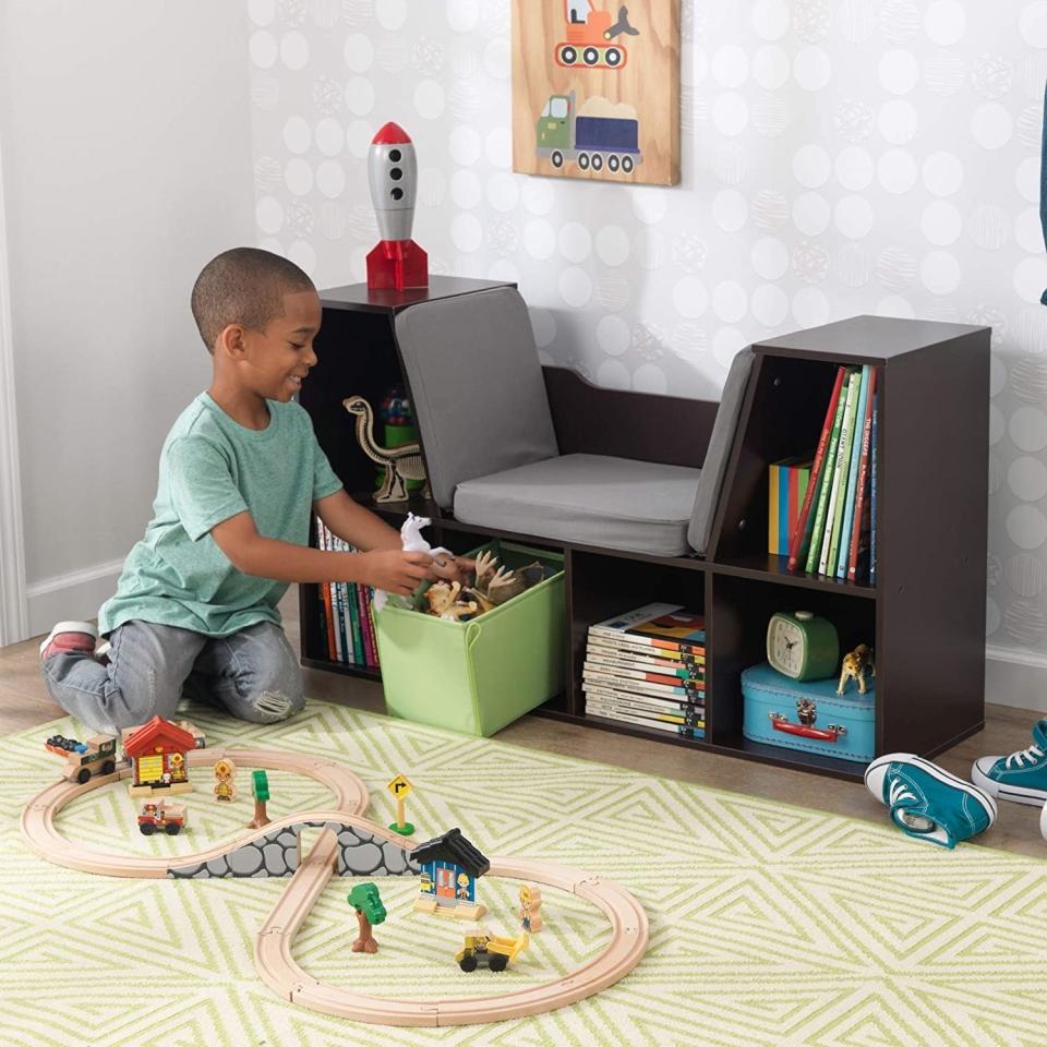 Save some floor space and give your kiddo's room a totally personalized touch at the same time when you put this in their room.<br /><br /><strong>Promising review:</strong> "This took about an hour and 15 minutes to assemble, which is great considering I&rsquo;m really not a handy person. The lower cubicles are quite short, which did impose a limit on which books we could put in, but the upper two are taller so it all worked out. It's quite sturdy and my kids are really excited to sit on it and read!" &mdash; <a href="https://www.amazon.com/gp/customer-reviews/R3CKZ0W5ZFAMRW?&amp;linkCode=ll2&amp;tag=huffpost-bfsyndication-20&amp;linkId=0ba55177fb07d3cf3ed8f483007e21fa&amp;language=en_US&amp;ref_=as_li_ss_tl" target="_blank" rel="nofollow noopener noreferrer" data-skimlinks-tracking="5854435" data-vars-affiliate="Amazon" data-vars-href="https://www.amazon.com/gp/customer-reviews/R3CKZ0W5ZFAMRW?tag=bfmal-20&amp;ascsubtag=5854435%2C17%2C37%2Cmobile_web%2C0%2C0%2C16324248" data-vars-keywords="cleaning,fast fashion" data-vars-link-id="16324248" data-vars-price="" data-vars-product-id="20942650" data-vars-product-img="" data-vars-product-title="" data-vars-retailers="Amazon">CBIsrael<br /><br /></a><strong>Get it from Amazon for <a href="https://www.amazon.com/KidKraft-Bookcase-Reading-Nook-White/dp/B00W610EZC?&amp;linkCode=ll1&amp;tag=huffpost-bfsyndication-20&amp;linkId=6875f83810fcab0df85af81b7c7893f5&amp;language=en_US&amp;ref_=as_li_ss_tl" target="_blank" rel="nofollow noopener noreferrer" data-skimlinks-tracking="5854435" data-vars-affiliate="Amazon" data-vars-asin="B00W610EZC" data-vars-href="https://www.amazon.com/dp/B00W610EZC?tag=bfmal-20&amp;ascsubtag=5854435%2C17%2C37%2Cmobile_web%2C0%2C0%2C16323360" data-vars-keywords="cleaning,fast fashion" data-vars-link-id="16323360" data-vars-price="" data-vars-product-id="18093808" data-vars-product-img="https://m.media-amazon.com/images/I/31QAp92UVEL.jpg" data-vars-product-title="KidKraft KKR14230 Bookcase with Reading Nook Toy, White, 46.46&quot; x 15.16&quot; x 5.04&quot;" data-vars-retailers="Amazon">$135.59+</a> (available in six colors).</strong>