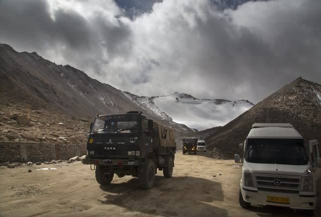 An Indian Army lorry crosses Chang la pass near Pangong Lake in Ladakh (Manish Swarup/AP)