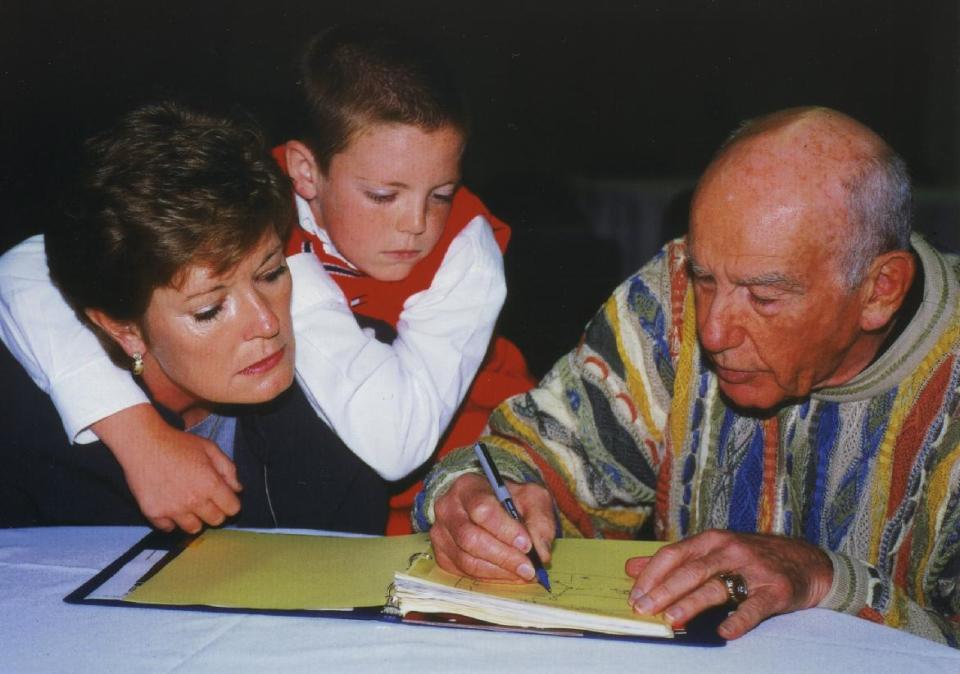 In this Oct. 12, 2000, file photo, provided by the University of Tennessee, Tyler Summitt, center, holds onto his mother, Tennessee women's basketball coach Pat Summitt, as she talks with former NBA coach Jack Ramsay at the Basketball Hall of Fame in Springfield, Mass. Ramsay, a Hall of Fame coach who led the Portland Trail Blazers to the 1977 NBA championship before he became one of the league's most respected broadcasters, has died following a long battle with cancer. He was 89. (AP Photo/University of Tennessee Sports Information, Debby Jennings)