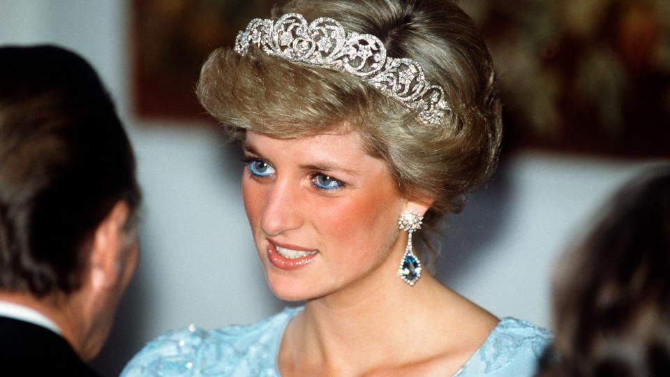<p> Princess Diana became well known for her penchant for blue eyeliner during her time as a royal, and perhaps one of her most famous blue outfits was debuted during a visit to Munich, Germany, in 1987. </p> <p> One evening, she attended a banquet for which she paired the Spencer family tiara with a stunning blue lace dress, aquamarine earrings, and of course, her signature blue eyeliner. The dress was designed by her go-to designer, Catherine Walker, meaning that her Spencer tiara and gowns by her favourite fashion designer had, by now, become a regular outfit combination for Princess Diana. </p>