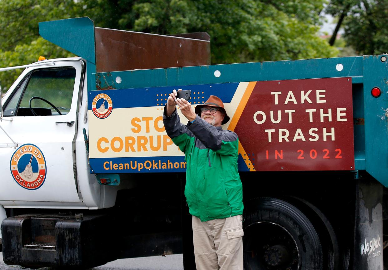 Jim Potts takes a selfie in front of a truck during a rally Wednesday by Clean-Up Oklahoma at the state Capitol.
