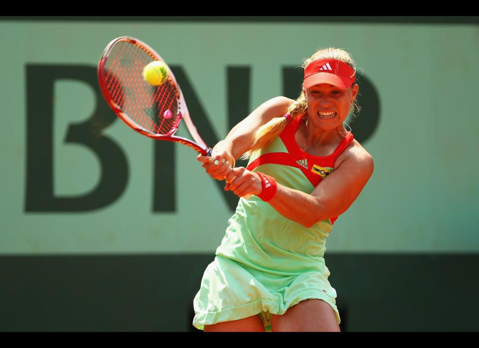 Angelique Kerber of Germany hits a backhand during the women's singles first round match between Angelique Kerber of Germany and Shuai Zhang of China on day one of the French Open at Roland Garros in Paris, France.      (Photo by Clive Brunskill/Getty Images)