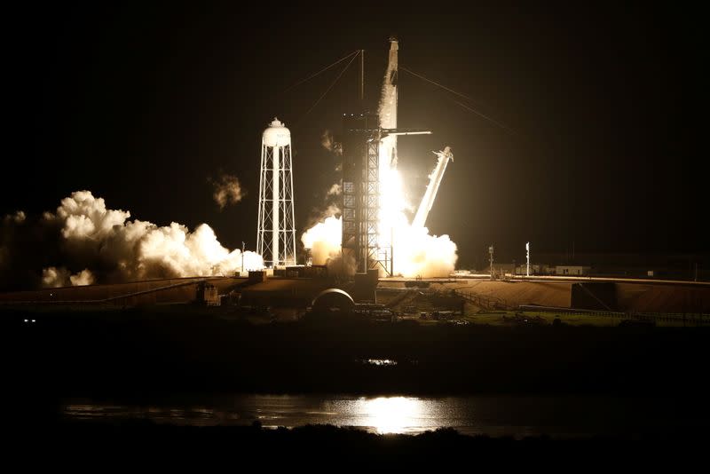 A SpaceX Falcon 9 rocket, topped with the Crew Dragon capsule, is launched carrying four astronauts on the first operational NASA commercial crew mission at Kennedy Space Center in Cape Canaveral