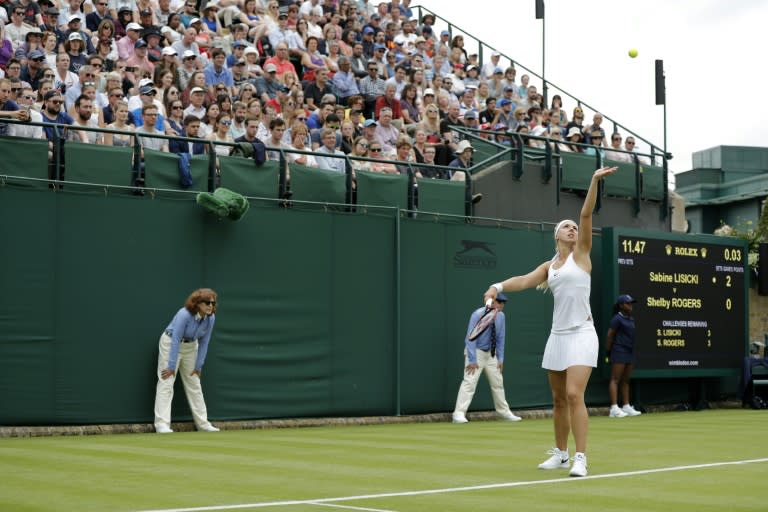 Germany's Sabine Lisicki serves against US player Shelby Rogers during their women's singles first round match on the first day of the 2016 Wimbledon Championships at The All England Lawn Tennis Club in Wimbledon, southwest London, on June 27, 2016