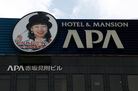 A signboard featuring picture of APA hotel chain's president Fumiko Motoya is seen at its headquarters building in Tokyo, Japan, January 19, 2017. REUTERS/Kim Kyung-Hoon