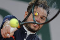 Switzerland's Stan Wawrinka plays a shot against Britain's Andy Murray in the first round match of the French Open tennis tournament at the Roland Garros stadium in Paris, France, Sunday, Sept. 27, 2020. (AP Photo/Christophe Ena)