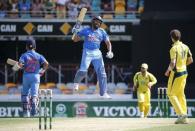 India's Rohit Sharma (C) jumps as he celebrates reaching his century during the second One Day International cricket match against Australia in Brisbane January 15, 2016. REUTERS/Glenn Hunt/AAP