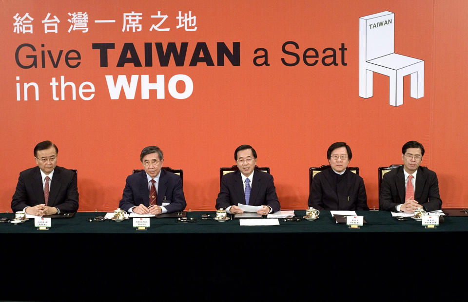 FILE - In this May 11, 2007, file photo, then Taiwan's President Chen Shui-bian, center, answers questions from Geneva-based journalists during a video conference where he protested the World Health Organization's rejection of the island's latest bid for membership, at the Presidential Palace in Taipei, Taiwan. Taiwan has called repeatedly for it to be allowed to participate in WHO, from which it has been barred by China. So strong is China’s diplomatic pressure that Taiwan can no longer take part in the organization’s annual World Health Assembly, even as an observer. (AP Photo, File)