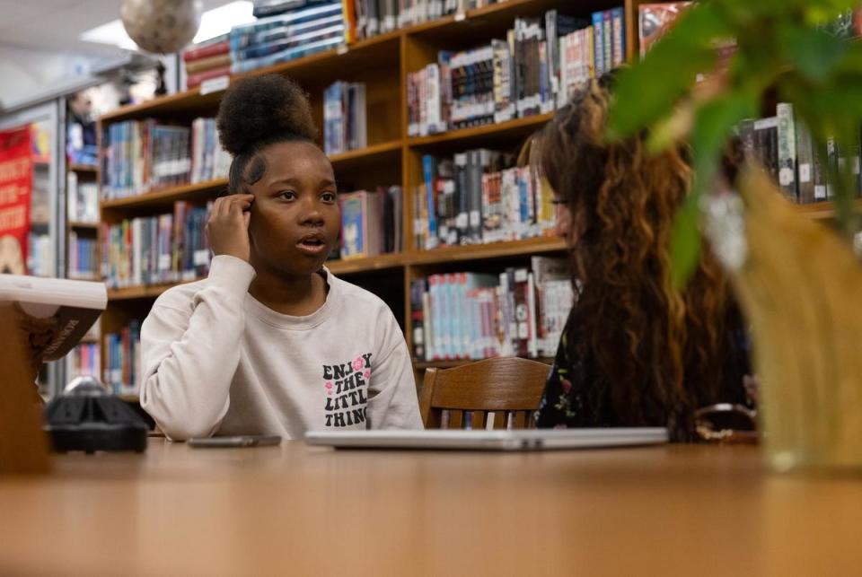 Jalen speaks with Britany Flores in the Smithville Public Library in Smithville, Texas on Mar. 11, 2024. Jalen is one of Flores’ patrons and she meets with Flores for some help and guidance when she needs.