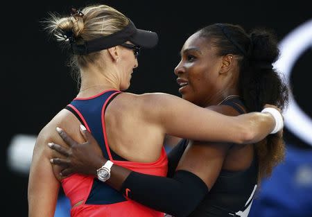 Tennis - Australian Open - Melbourne Park, Melbourne, Australia - 26/1/17 Serena Williams of the U.S. hugs Croatia's Mirjana Lucic-Baroni after winning her Women's singles semi-final match. REUTERS/Thomas Peter