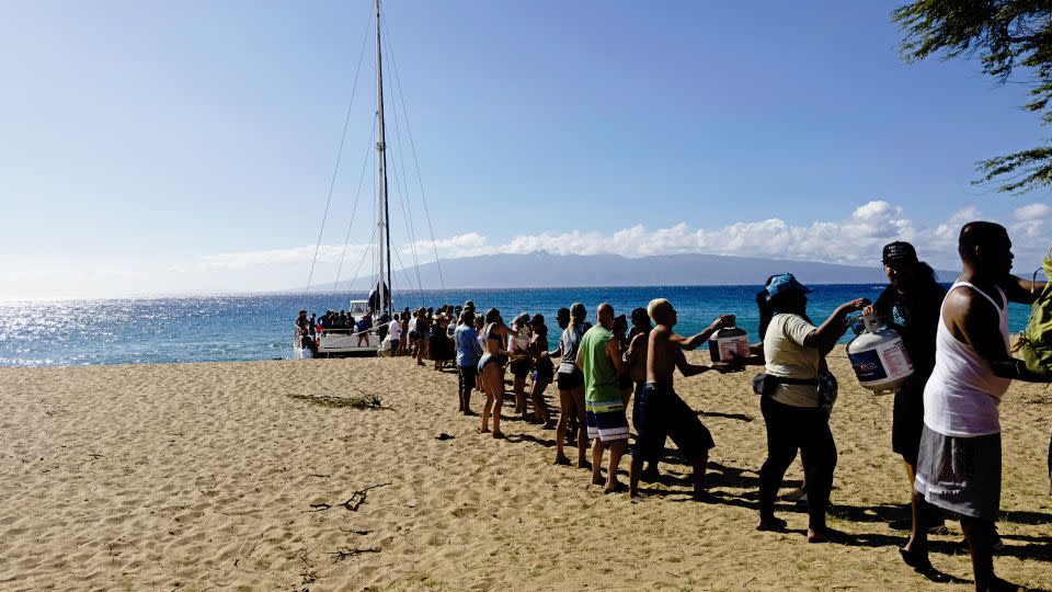 Supplies are being unloaded onto Kahekili Beach Park from the Ocean Spirit, just north of Lahaina. - Paul Murphy/CNN