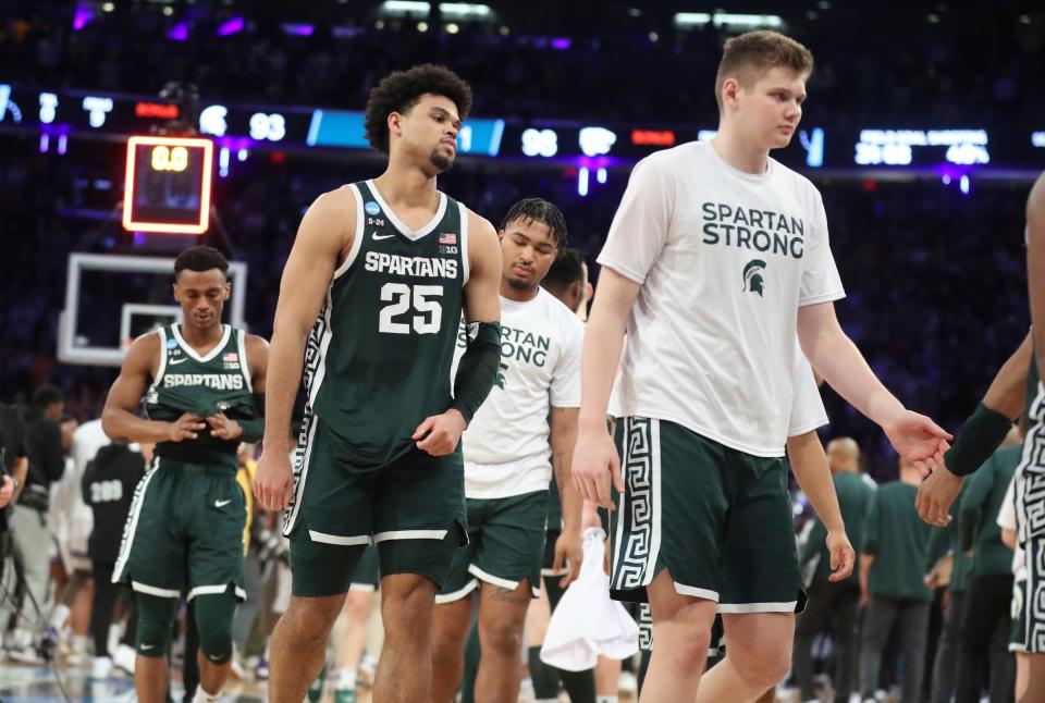 Michigan State forwards Malik Hall, left, and Jaxon Kohler walk off the court after MSU's 98-93 overtime loss to Kansas State in the Sweet 16 on Thursday, March 23, 2023, in New York.