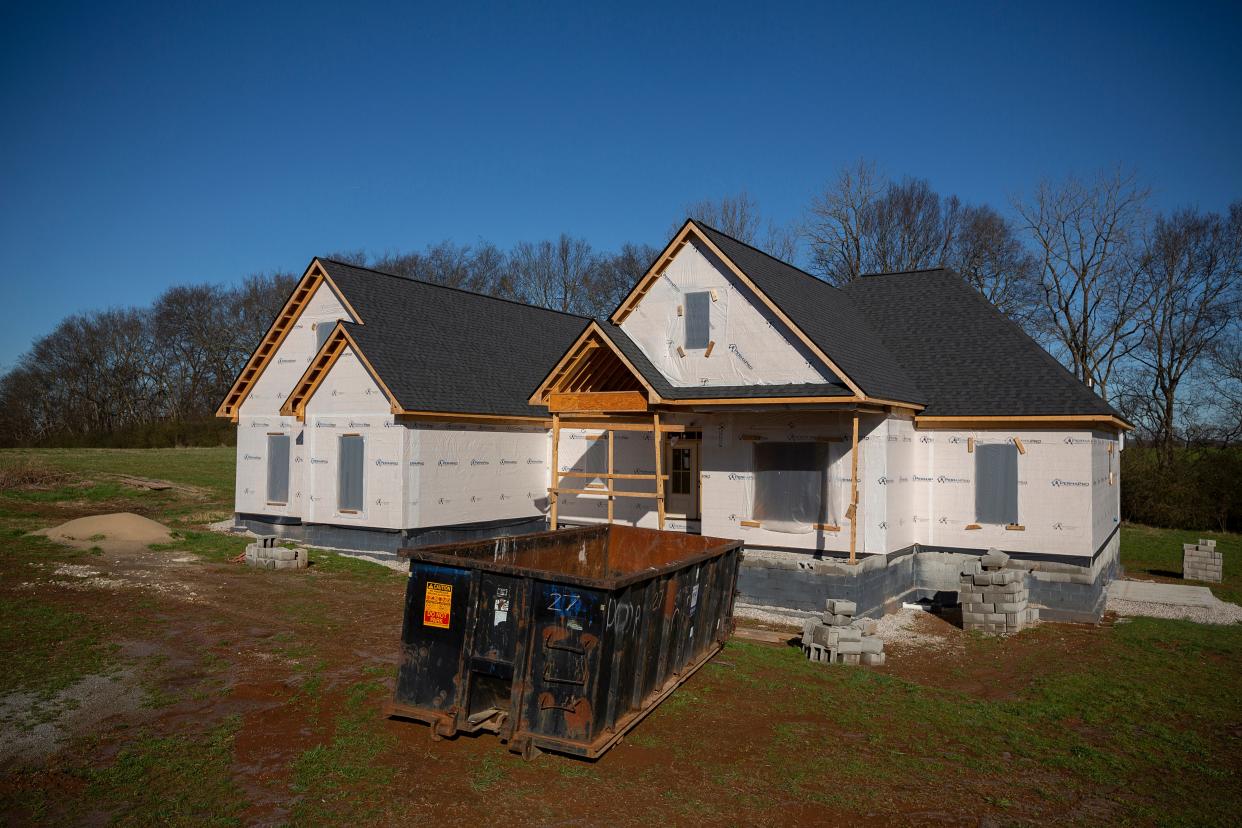 A custom built home constructed by McBroom Home Builders rests uncompleted near Mt. Pleasant, Tenn., due to ongoing supply chain issues caused by the ongoing COVID-19 pandemic on Monday, Jan 10, 2022.